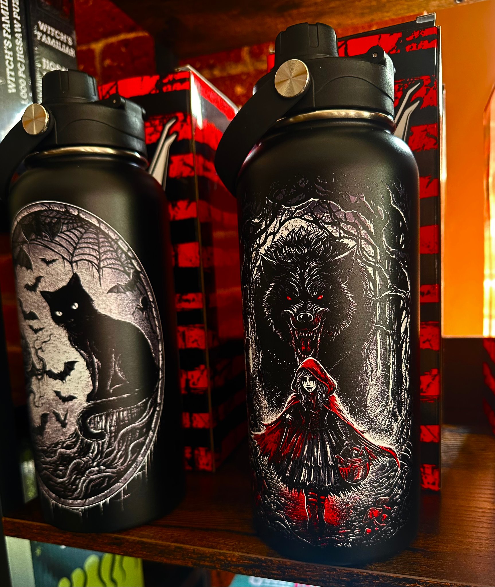 Gothic horror water bottles — black cat with bats and Red Riding Hood with werewolf designs